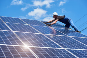 Solar panels being installed on roof